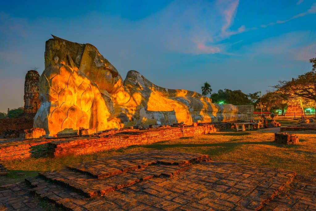 Reclining Buddha statue lighting up at night