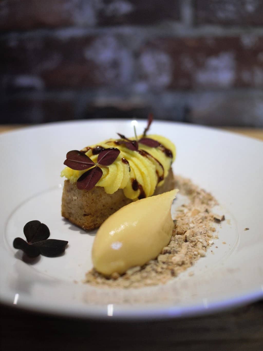 Almond cake with orange sorbet and egg cream