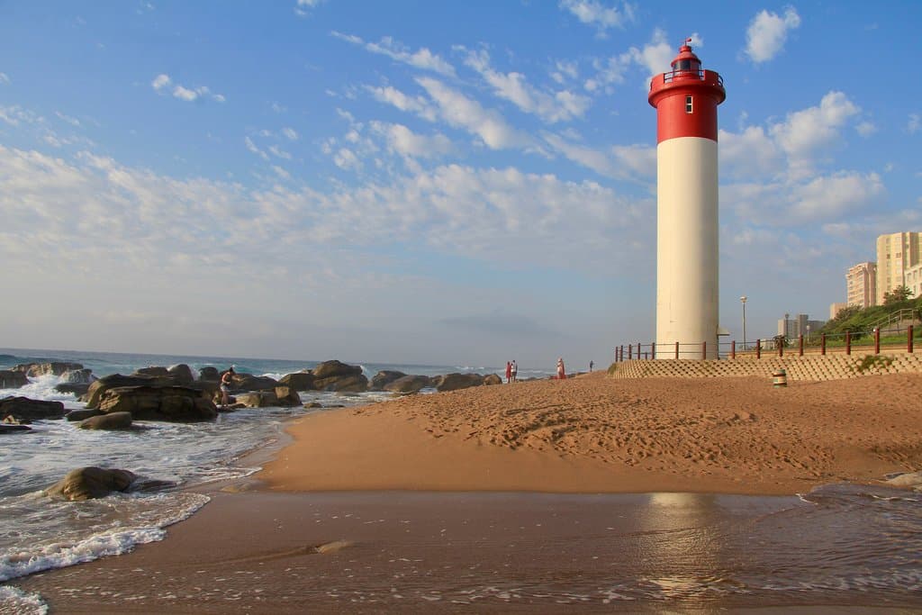 Early morning light kisses the beach and the lighthouse as the tide comes in. Grab a coffee to go from the Lifesavers Hut and enjoy the view.