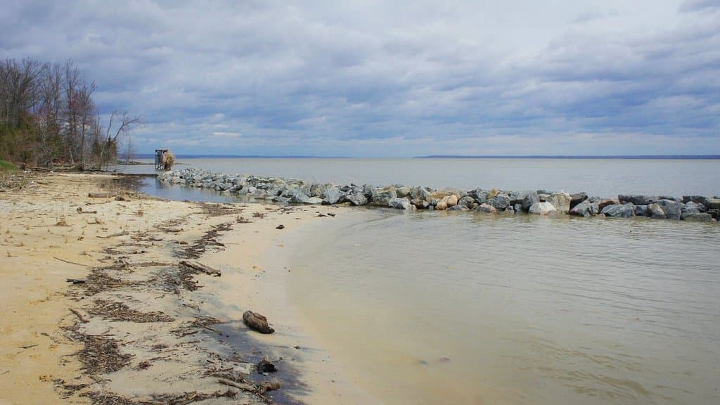Canoe in campsite and breakwater