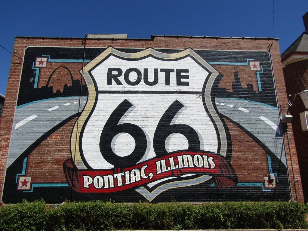 The Picture of the Route 66 sign painter on the back of the building.