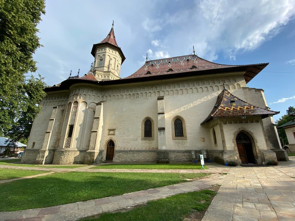 The church - the wall that is "white" today was painted centuries ago.