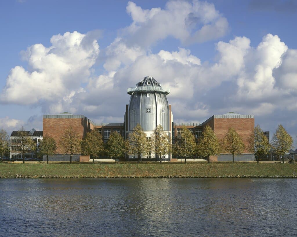 This is the riverside of the museum. The main entrance is actually on the opposite side, along the street. However, the zinc-covered tower or Cupola you see here is one of the main architectural features of the museum. 
Read more about the architecture on our website:
https://www.bonnefanten.nl/en/art-artists/explore-the-building/explore-the-building
Photo by Kim Zwarts