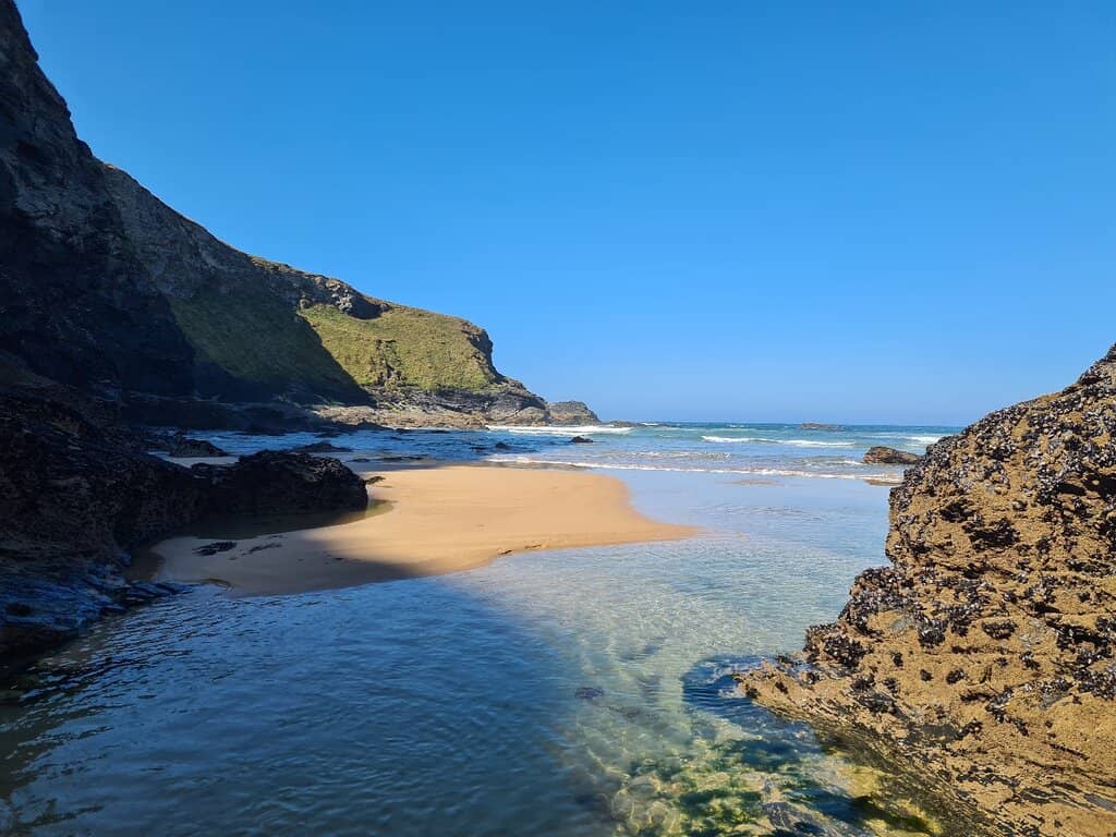 Golden Sands and Dramatic Cliffs