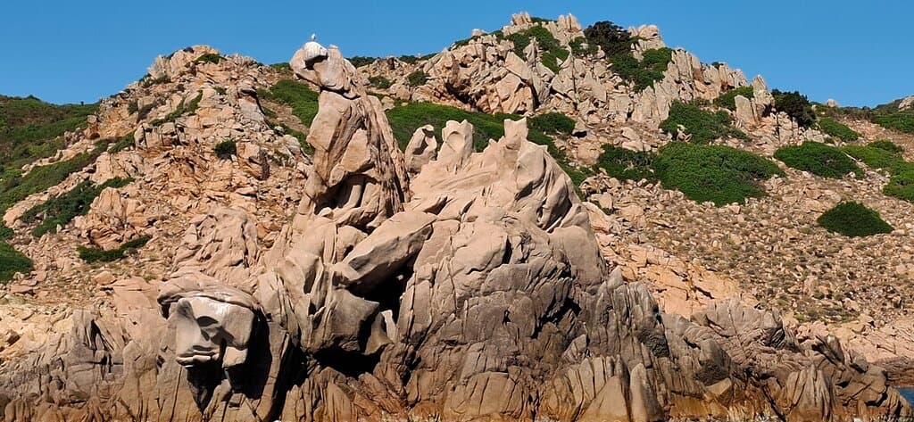 An oversized hornet pushing another one down the cliff