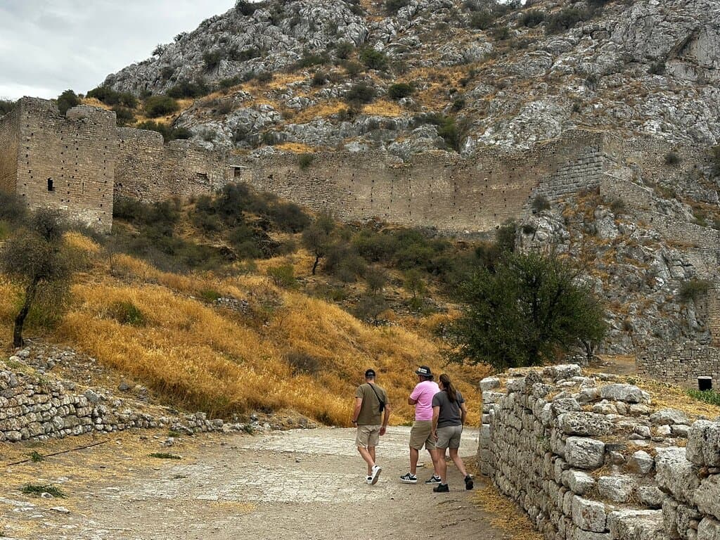 Acrocorinth  (free entry 8:30am) explore the site. It has been continuously occupied since the Greek Archaic period (800 to 480 B.C.) and may have been a fortress even earlier.  Ancient Corinth, at the northern base of the hill of Acrocorinth. Excavations here have revealed occupation from as early as 6,500 B.C. The Temple of Apollo at the site (seven tall Doric columns) is one of the largest and earliest Doric temples in Greece.